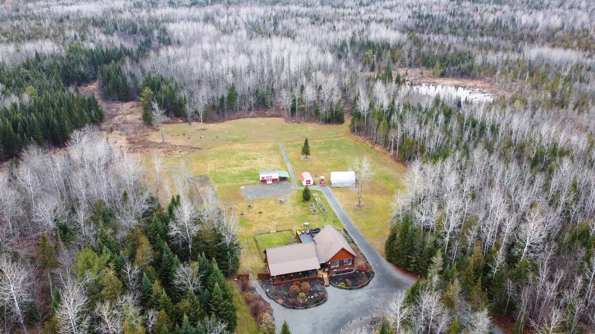 2,000 Sq. Ft. Log Home on 48 Acres  – Milo, Maine