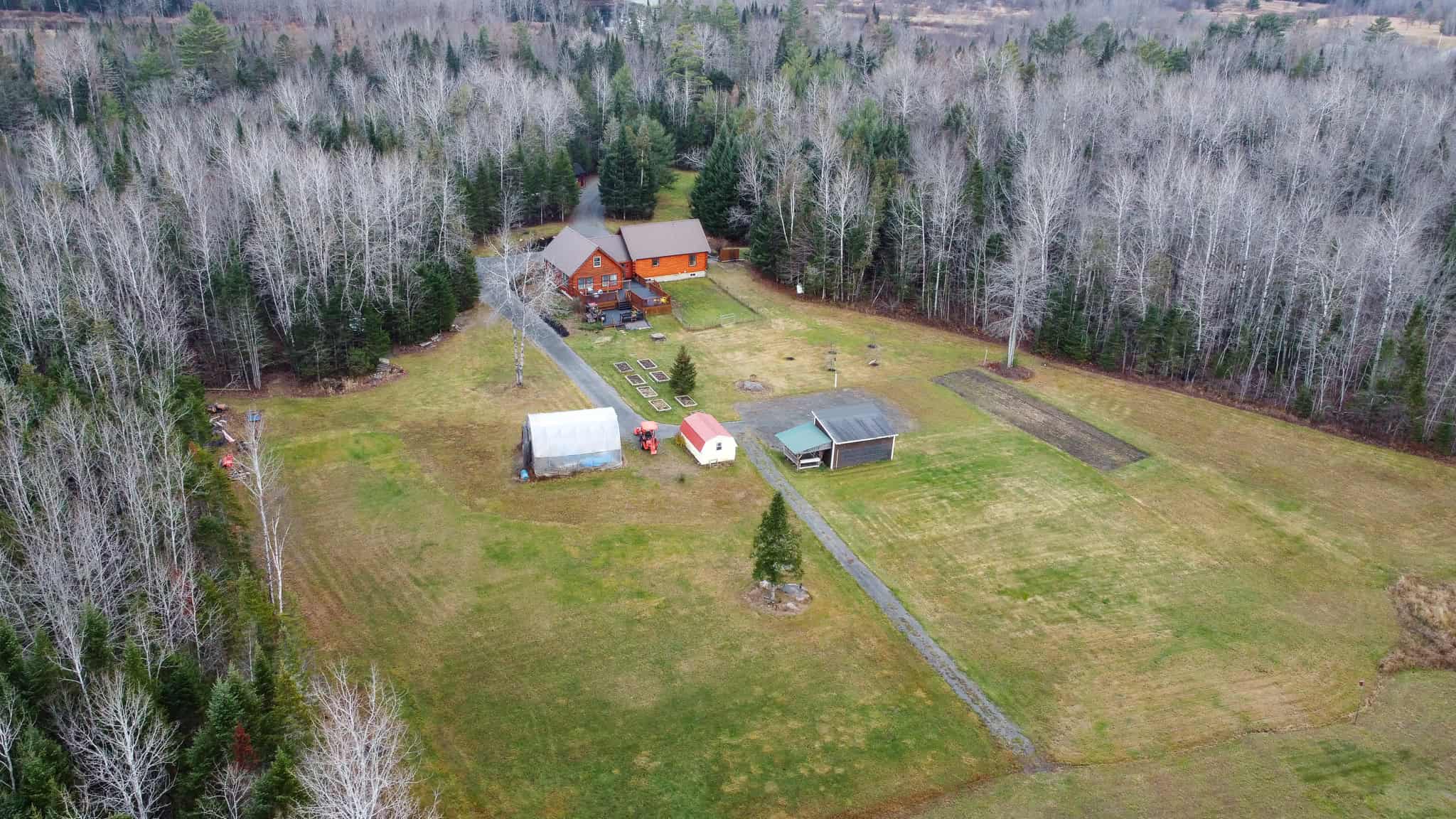 2,000 Sq. Ft. Log Home on 48 Acres  – Milo, Maine