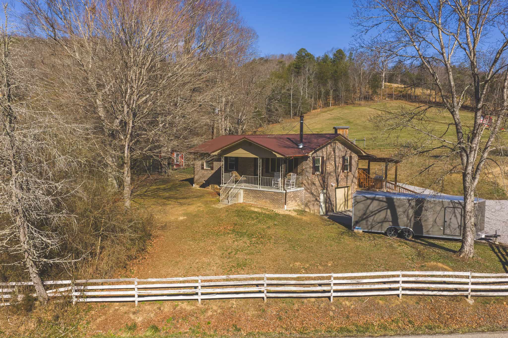 Freedom, Income Potential, and a Turnkey Farmstead: Exceptionally Clean Brick Ranch on 59+ Unrestricted Acres in Claiborne County, Tennessee