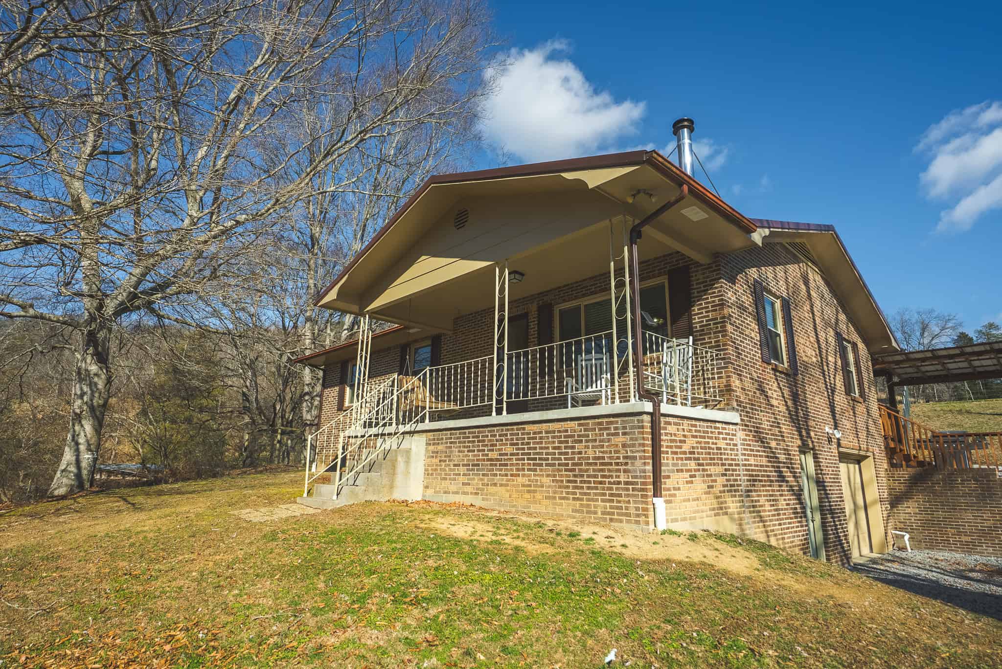 Freedom, Income Potential, and a Turnkey Farmstead: Exceptionally Clean Brick Ranch on 59+ Unrestricted Acres in Claiborne County, Tennessee
