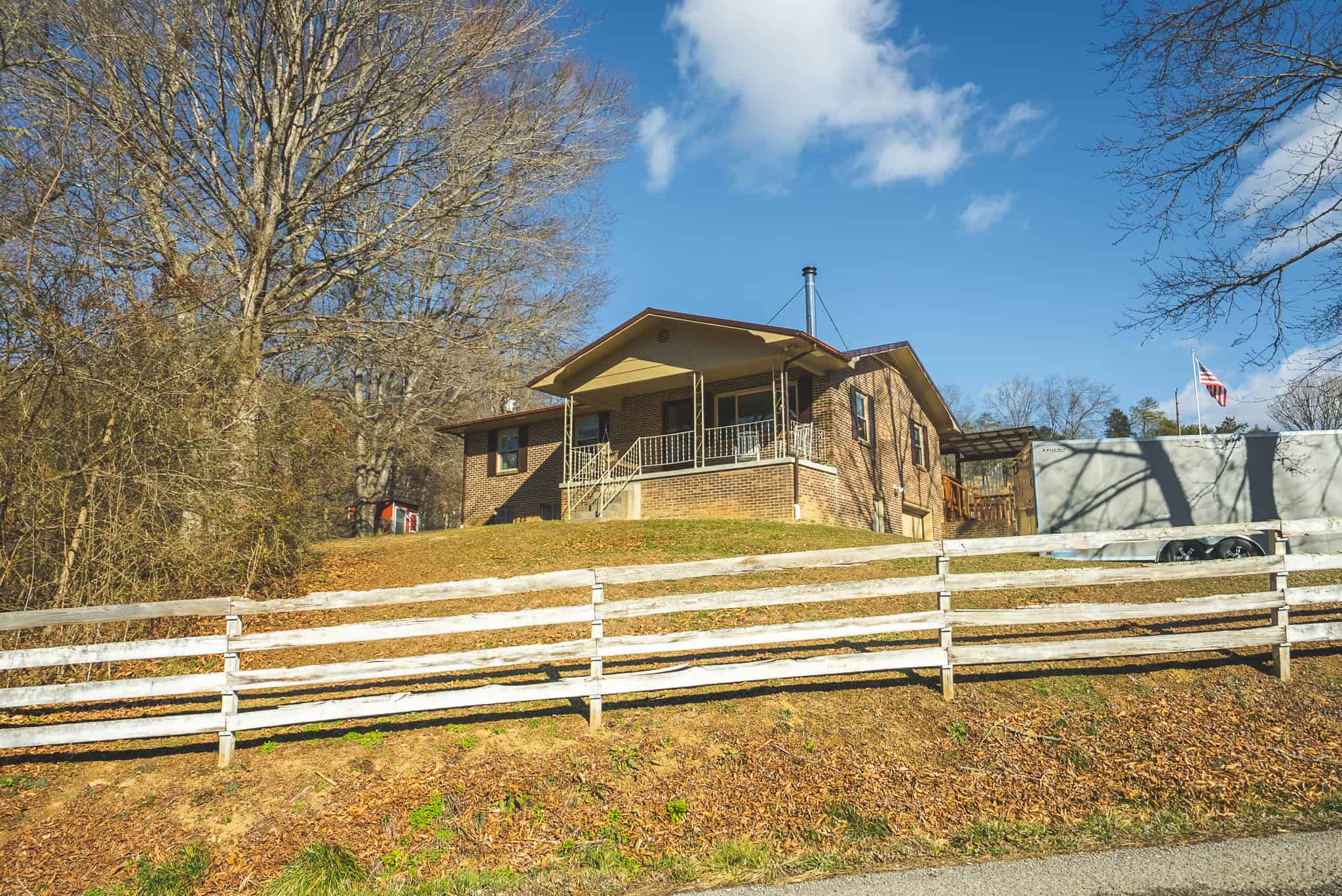 Freedom, Income Potential, and a Turnkey Farmstead: Exceptionally Clean Brick Ranch on 59+ Unrestricted Acres in Claiborne County, Tennessee