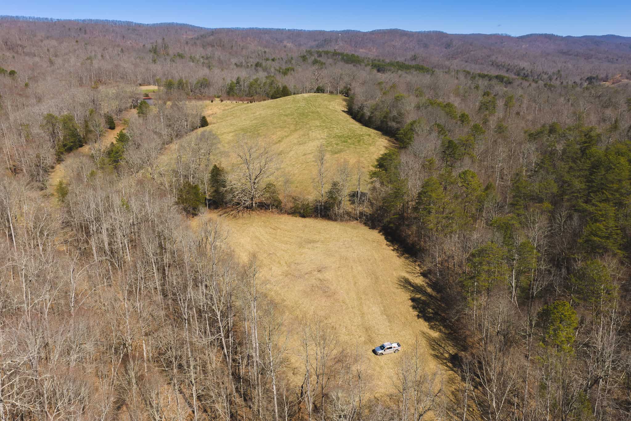 102.62 Unrestricted Acres with Farmhouse, Barn, Pond, Pasture, Timber, and East Tennessee Mountain Views in Hancock County