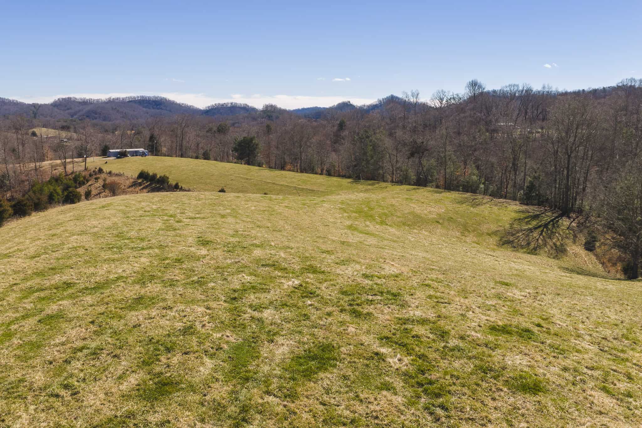 102.62 Unrestricted Acres with Farmhouse, Barn, Pond, Pasture, Timber, and East Tennessee Mountain Views in Hancock County