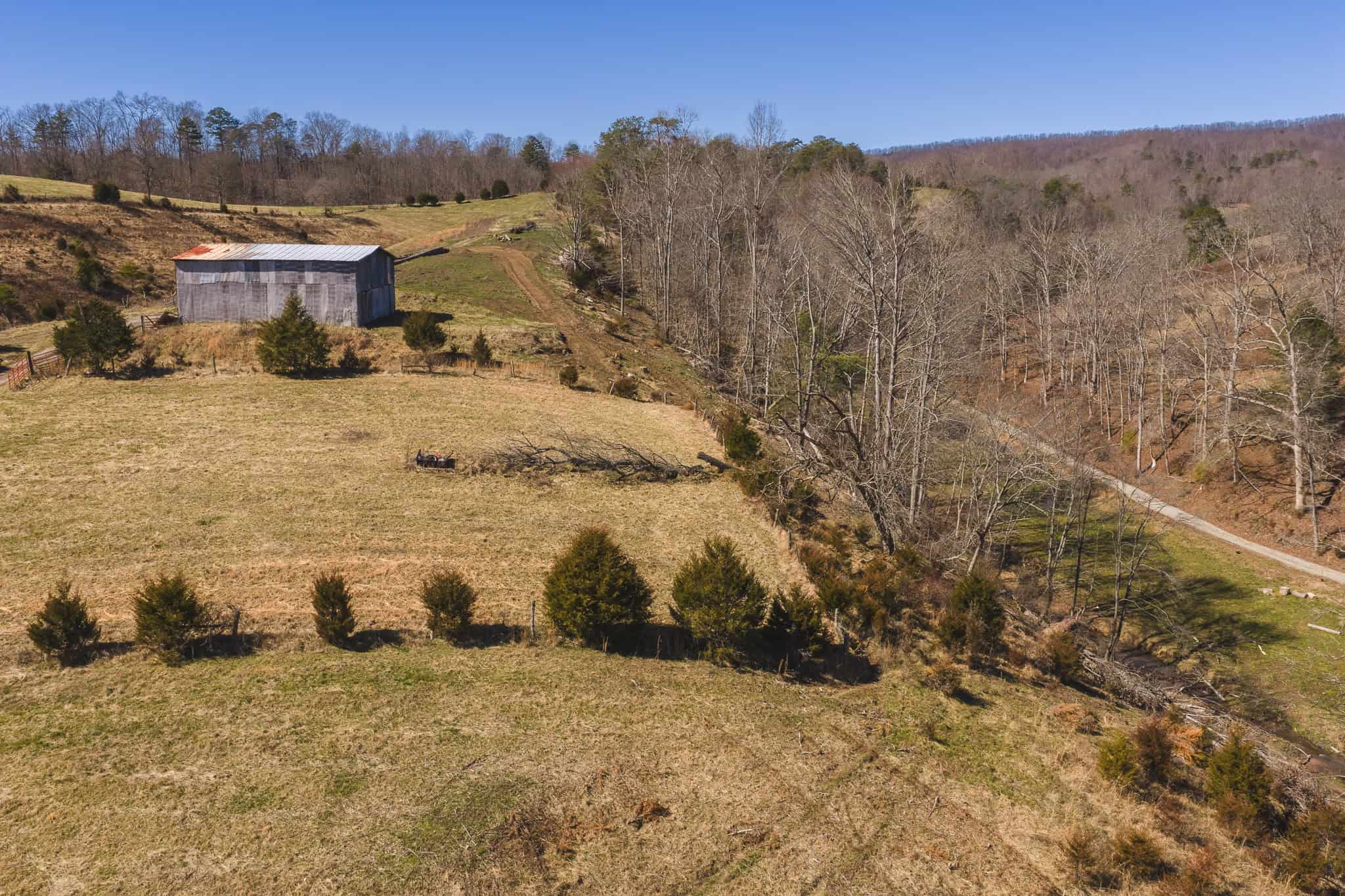 102.62 Unrestricted Acres with Farmhouse, Barn, Pond, Pasture, Timber, and East Tennessee Mountain Views in Hancock County