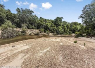 23 Acres of Riverfront Property with Sand Bar and Cabins