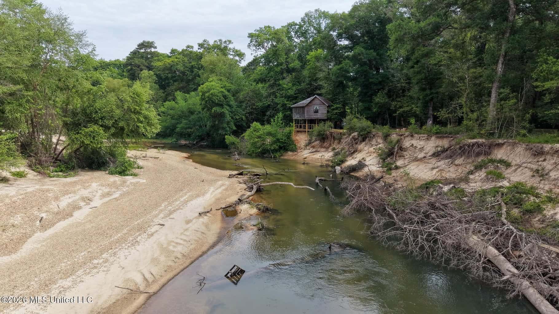 23 Acres of Riverfront Property with Sand Bar and Cabins