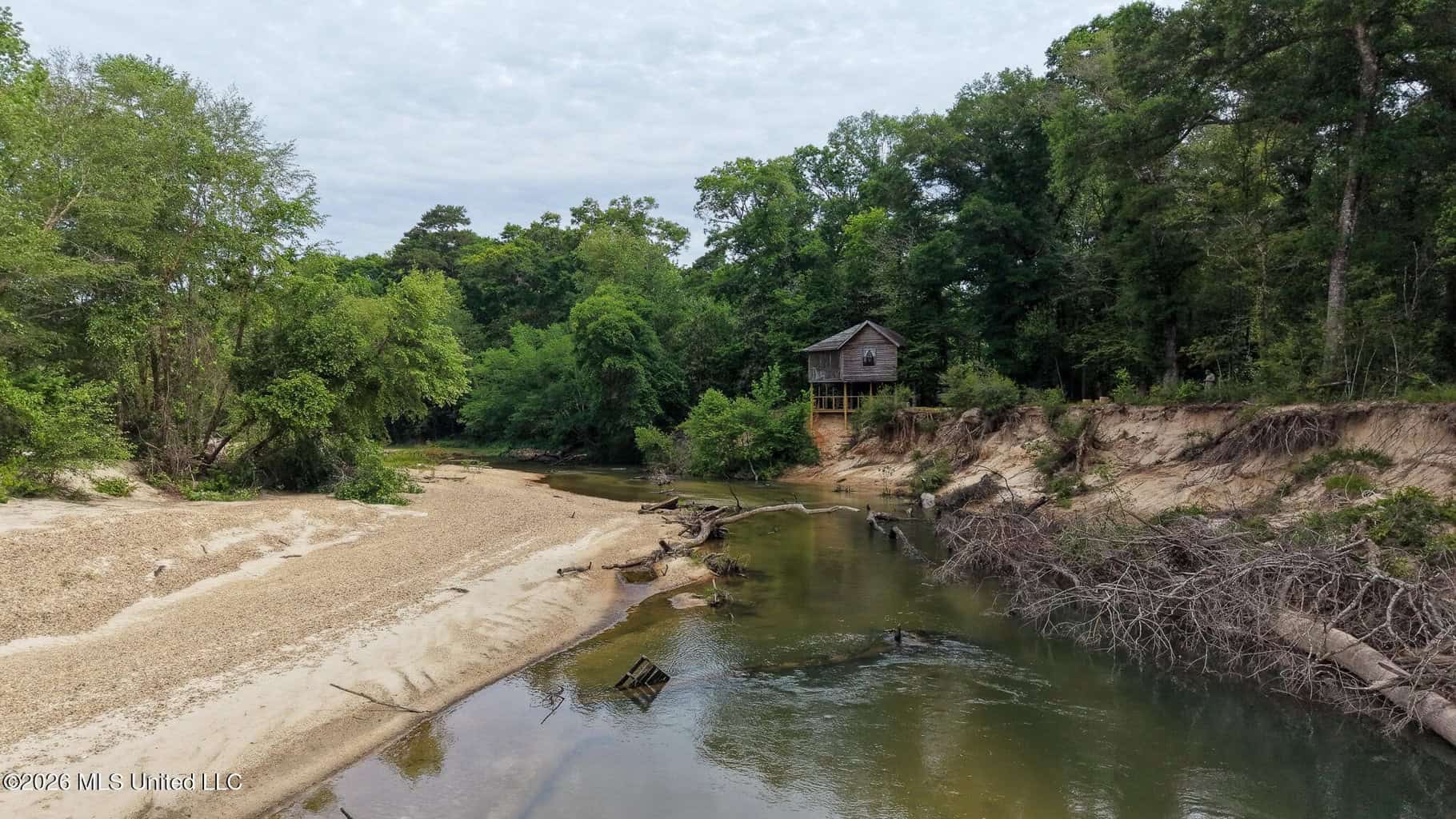 23 Acres of Riverfront Property with Sand Bar and Cabins