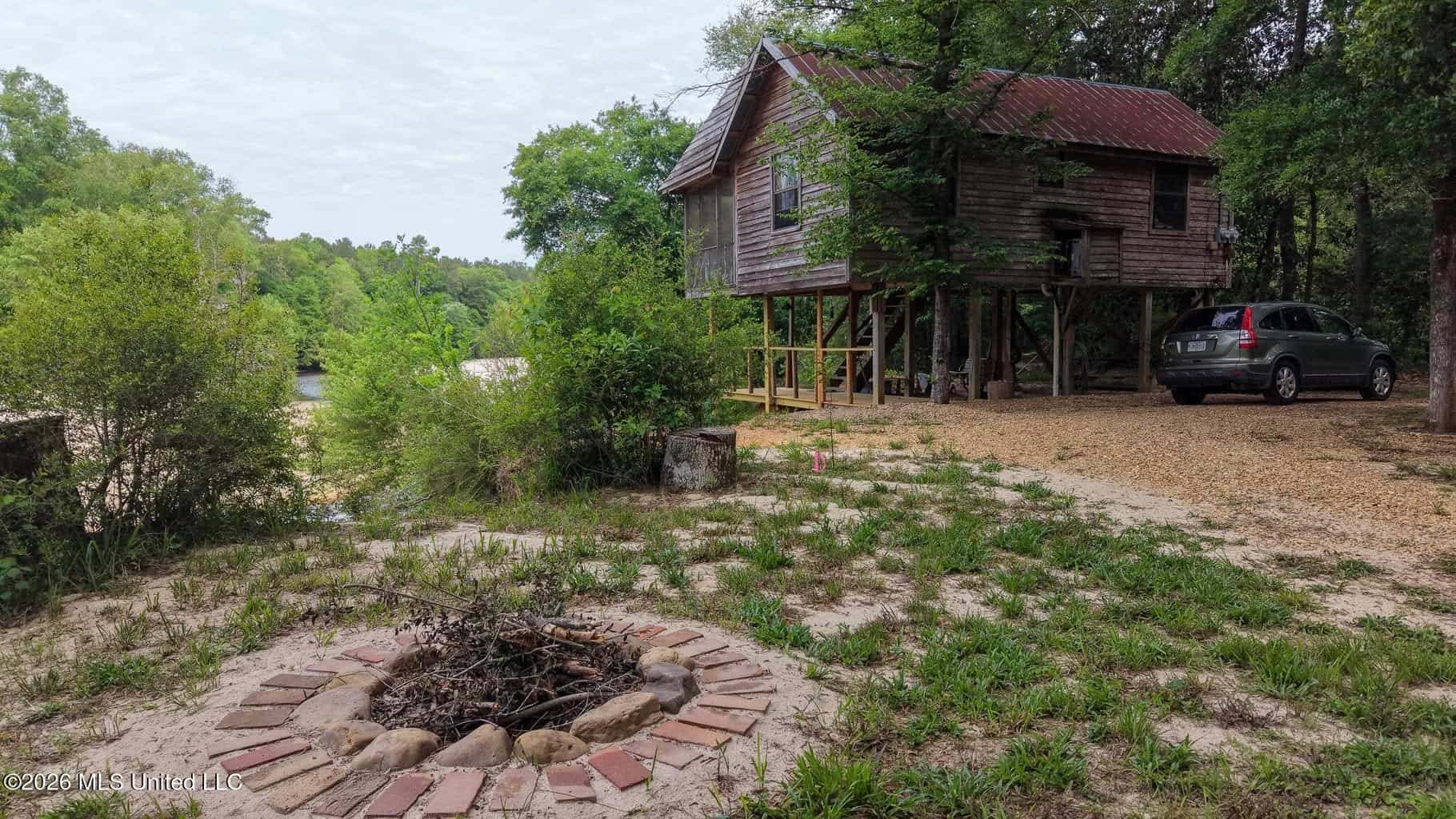 23 Acres of Riverfront Property with Sand Bar and Cabins