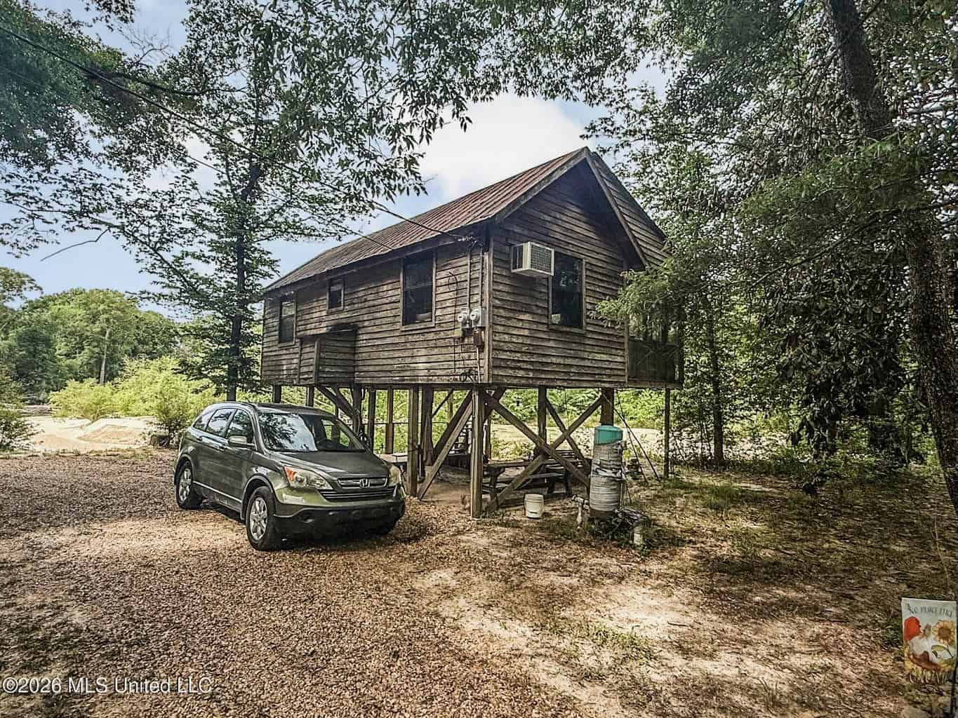 23 Acres of Riverfront Property with Sand Bar and Cabins