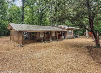 23 Acres of Riverfront Property with Sand Bar and Cabins
