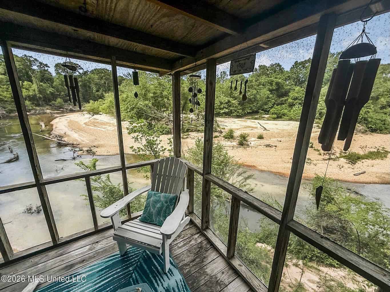 23 Acres of Riverfront Property with Sand Bar and Cabins