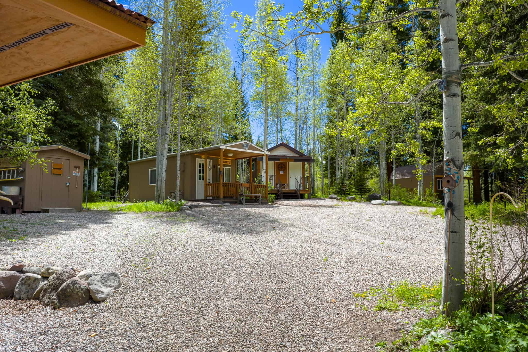Colorado Mountain Hunting Retreat Surrounded By Thousands of Acres of Public Land in Garfield County With Low Flowing Creek and Multiple Cabins and Lodge