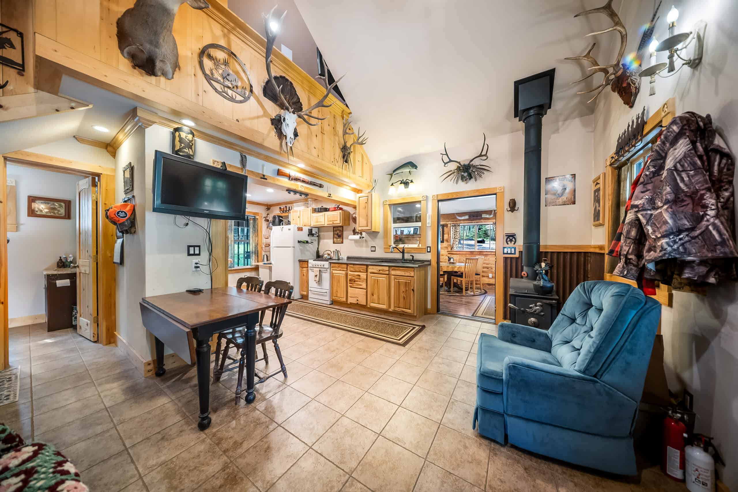 Colorado Mountain Hunting Retreat Surrounded By Thousands of Acres of Public Land in Garfield County With Low Flowing Creek and Multiple Cabins and Lodge