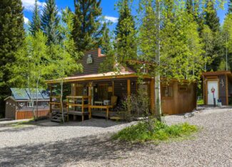 Colorado Mountain Hunting Retreat Surrounded By Thousands of Acres of Public Land in Garfield County With Low Flowing Creek and Multiple Cabins and Lodge