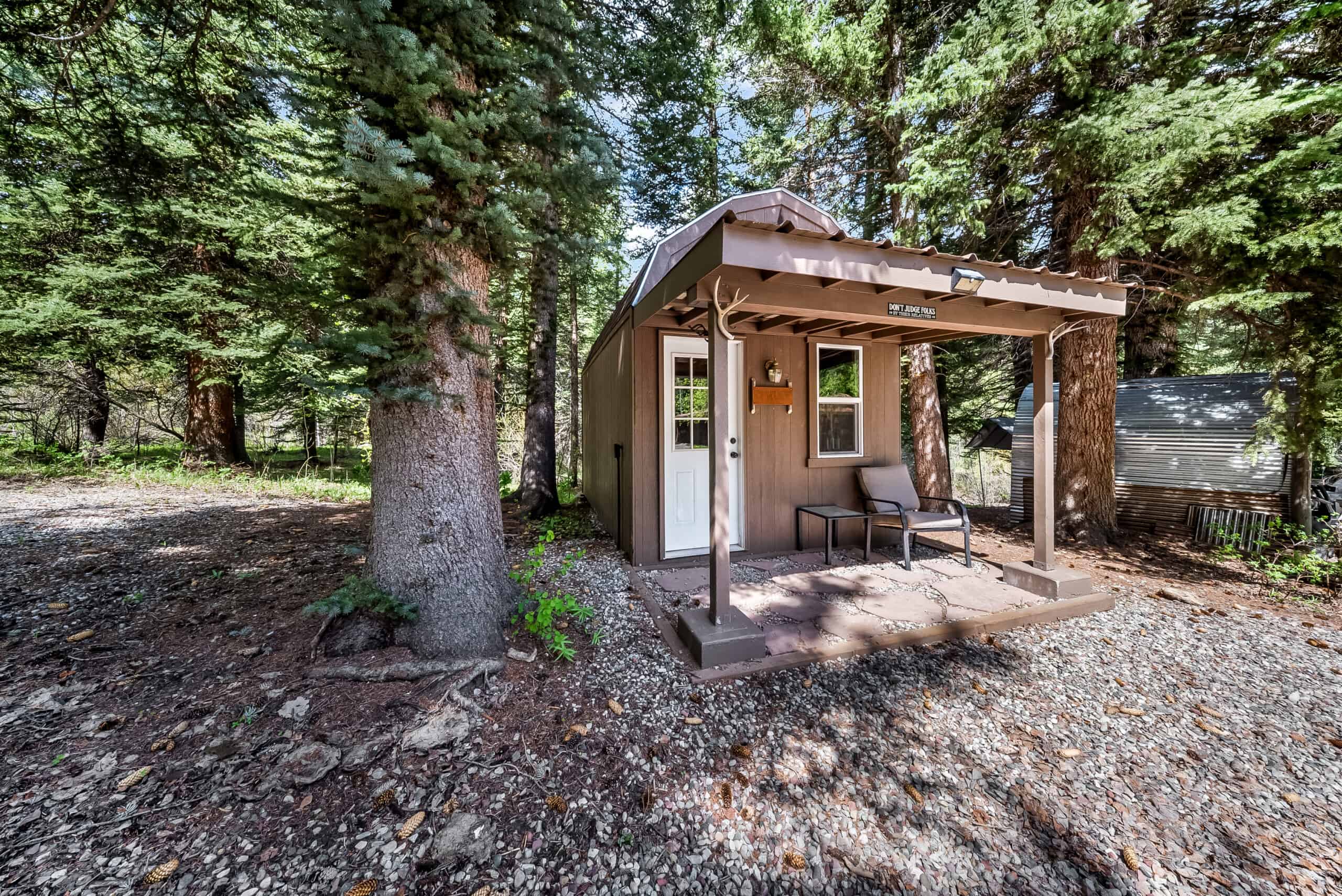 Colorado Mountain Hunting Retreat Surrounded By Thousands of Acres of Public Land in Garfield County With Low Flowing Creek and Multiple Cabins and Lodge
