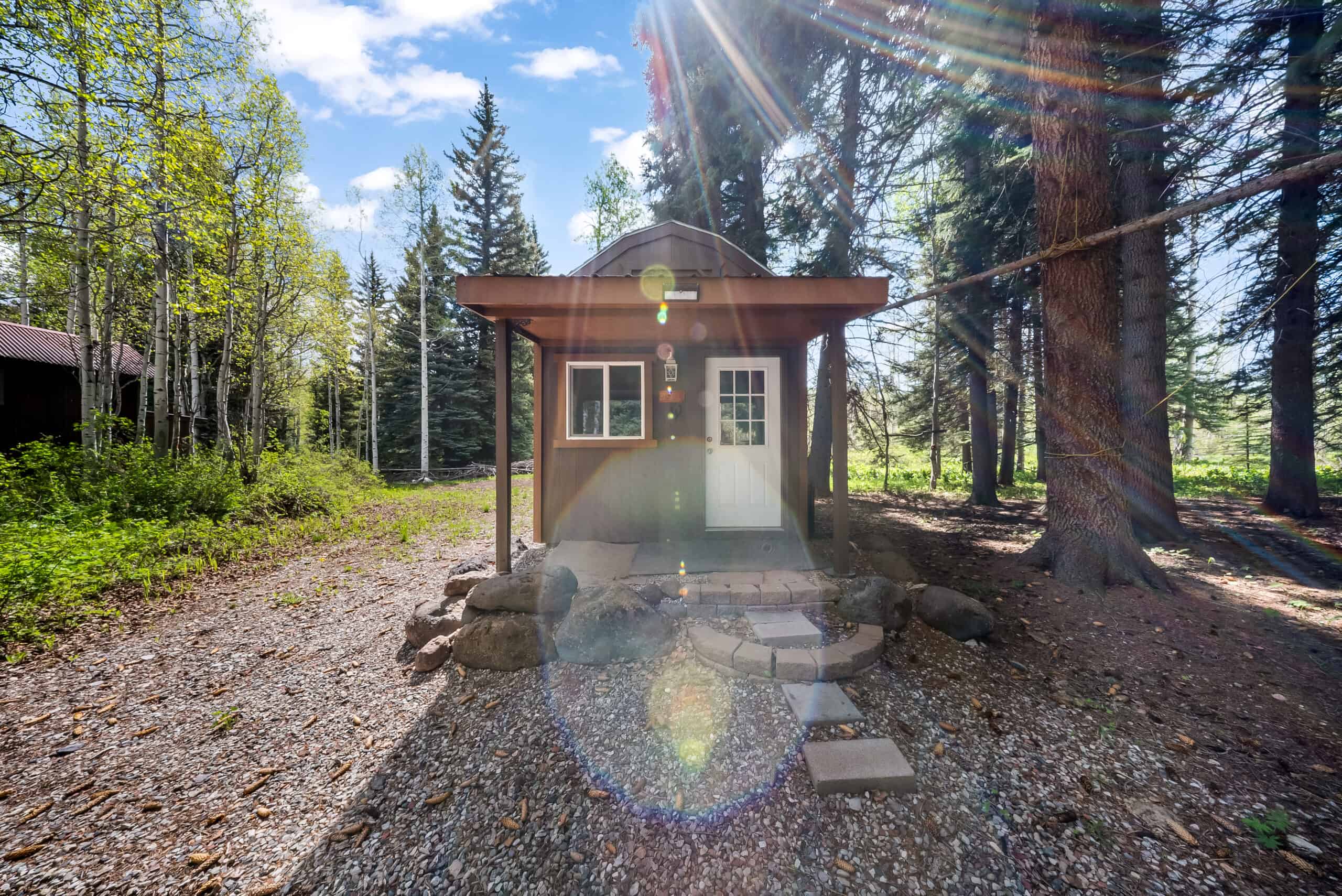 Colorado Mountain Hunting Retreat Surrounded By Thousands of Acres of Public Land in Garfield County With Low Flowing Creek and Multiple Cabins and Lodge