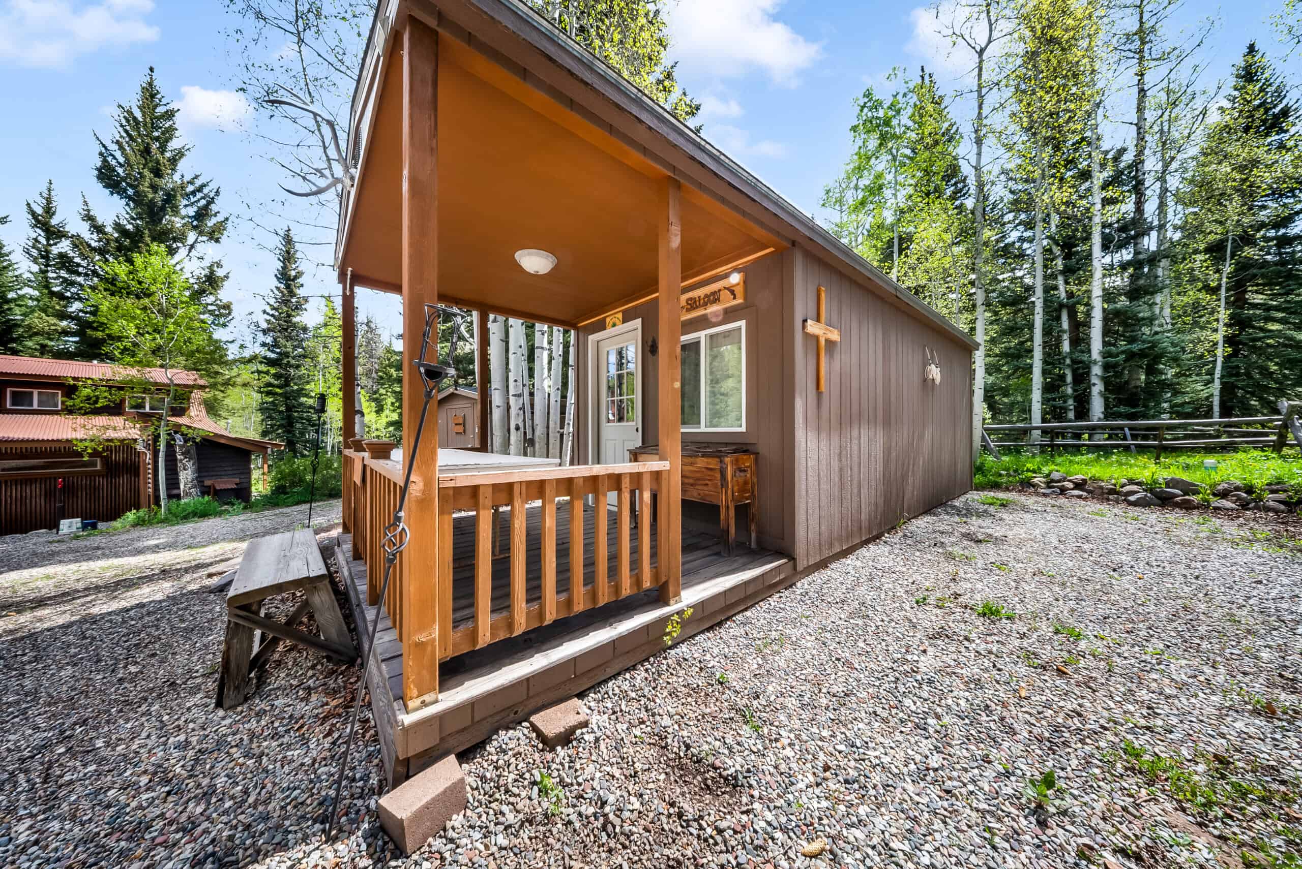 Colorado Mountain Hunting Retreat Surrounded By Thousands of Acres of Public Land in Garfield County With Low Flowing Creek and Multiple Cabins and Lodge