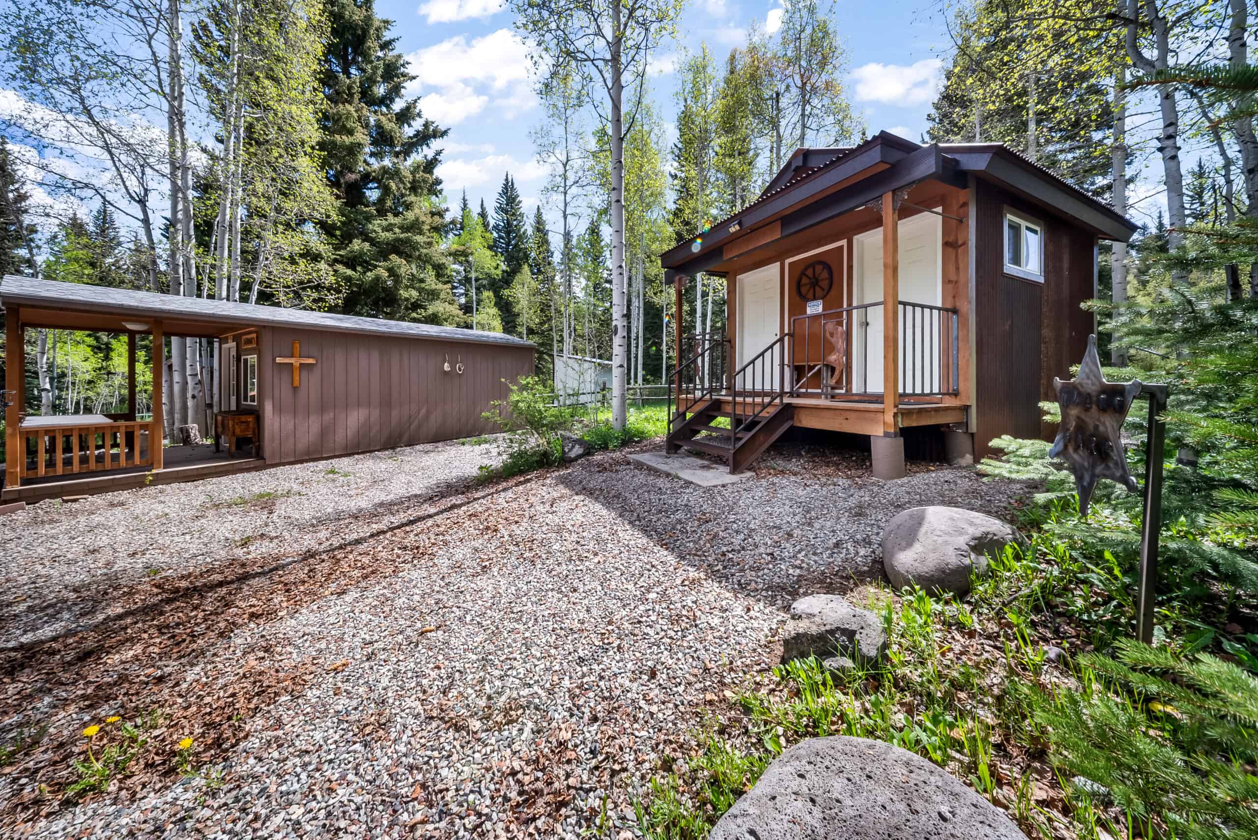 Colorado Mountain Hunting Retreat Surrounded By Thousands of Acres of Public Land in Garfield County With Low Flowing Creek and Multiple Cabins and Lodge