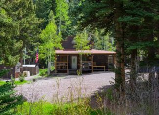 Colorado Mountain Hunting Retreat Surrounded By Thousands of Acres of Public Land in Garfield County With Low Flowing Creek and Multiple Cabins and Lodge
