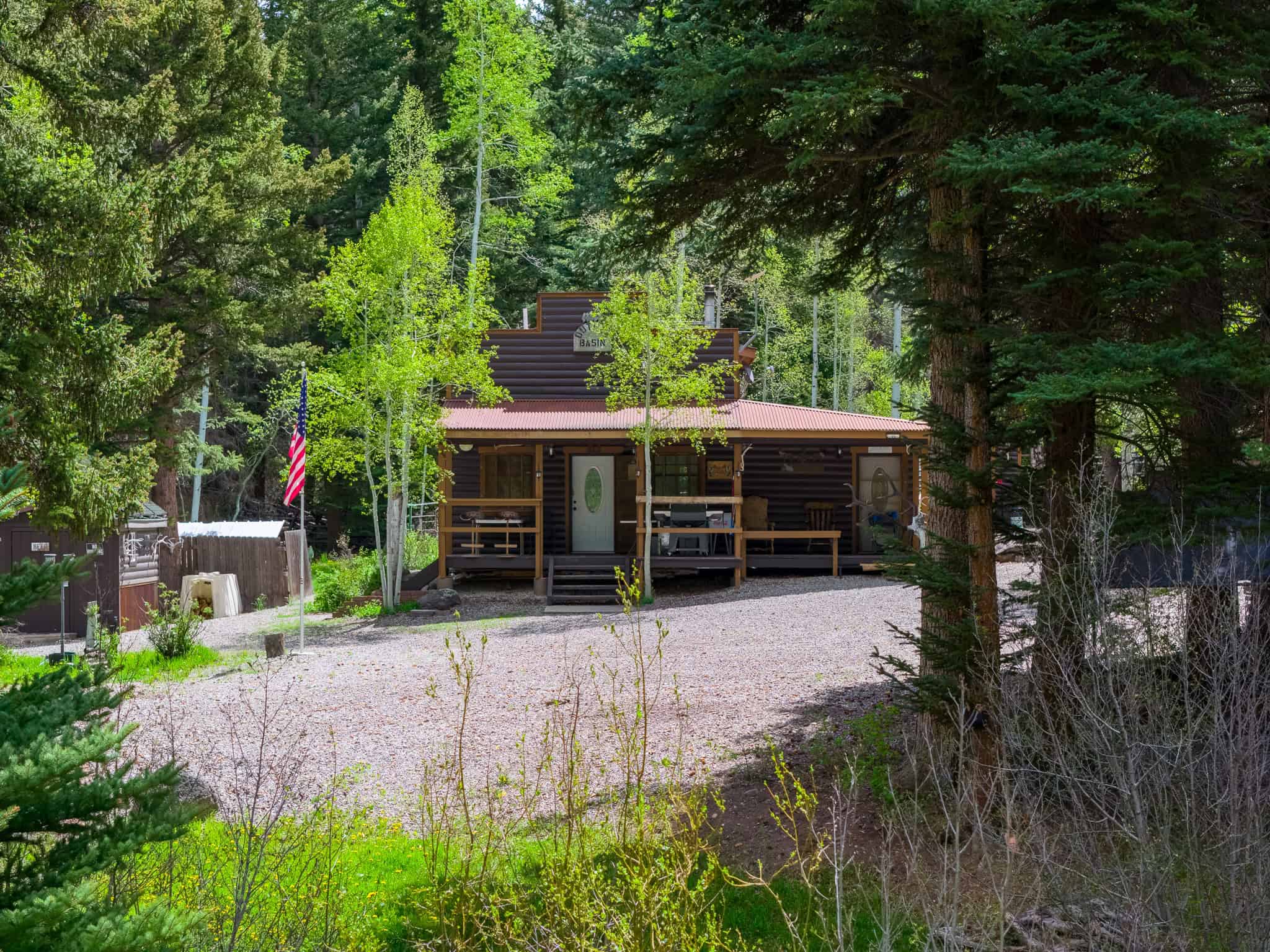 Colorado Mountain Hunting Retreat Surrounded By Thousands of Acres of Public Land in Garfield County With Low Flowing Creek and Multiple Cabins and Lodge