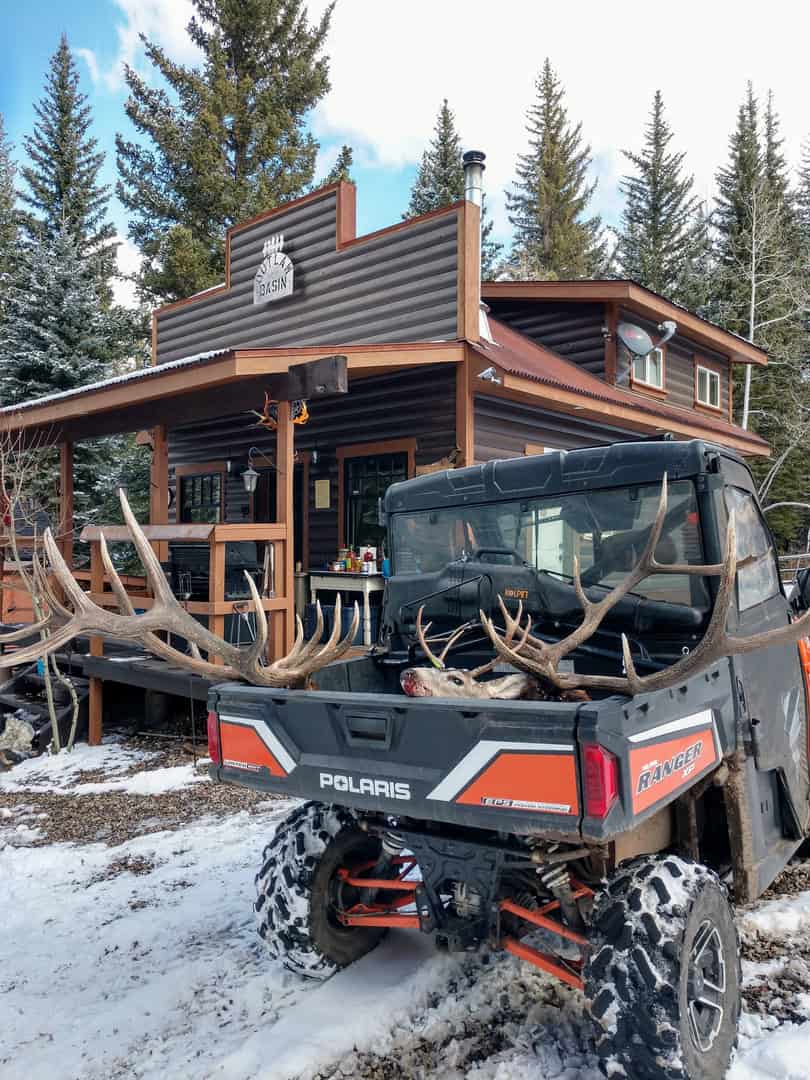 Colorado Mountain Hunting Retreat Surrounded By Thousands of Acres of Public Land in Garfield County With Low Flowing Creek and Multiple Cabins and Lodge