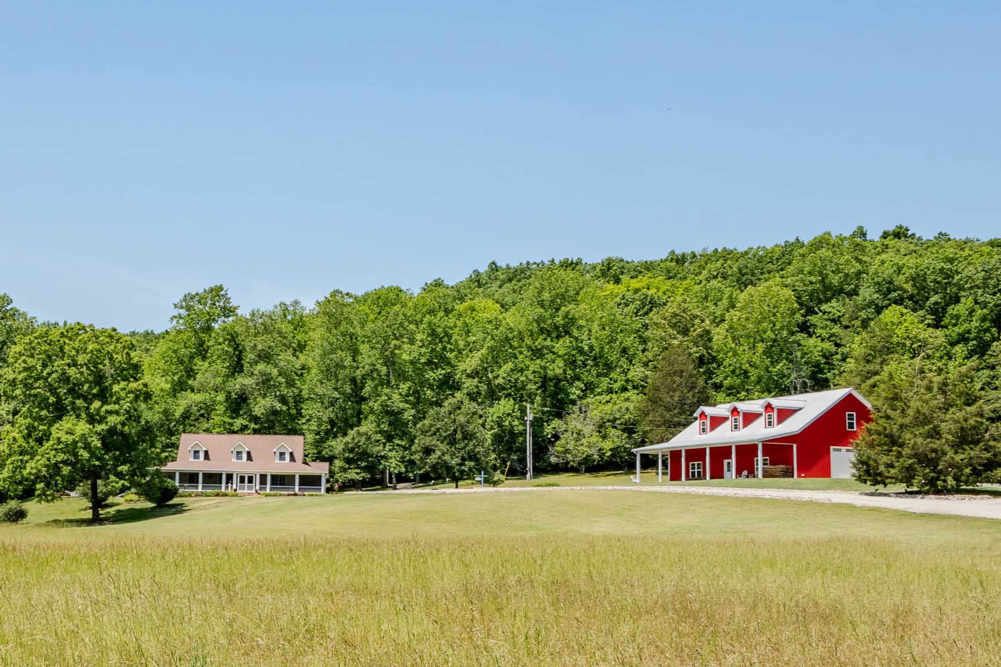 PRIVATE 394 ACRE TENNESSEE ESTATE WITH HOME, SHOP, CREEK, POND,TEARMING WITH WHITETAIL DEER AND TURKEY