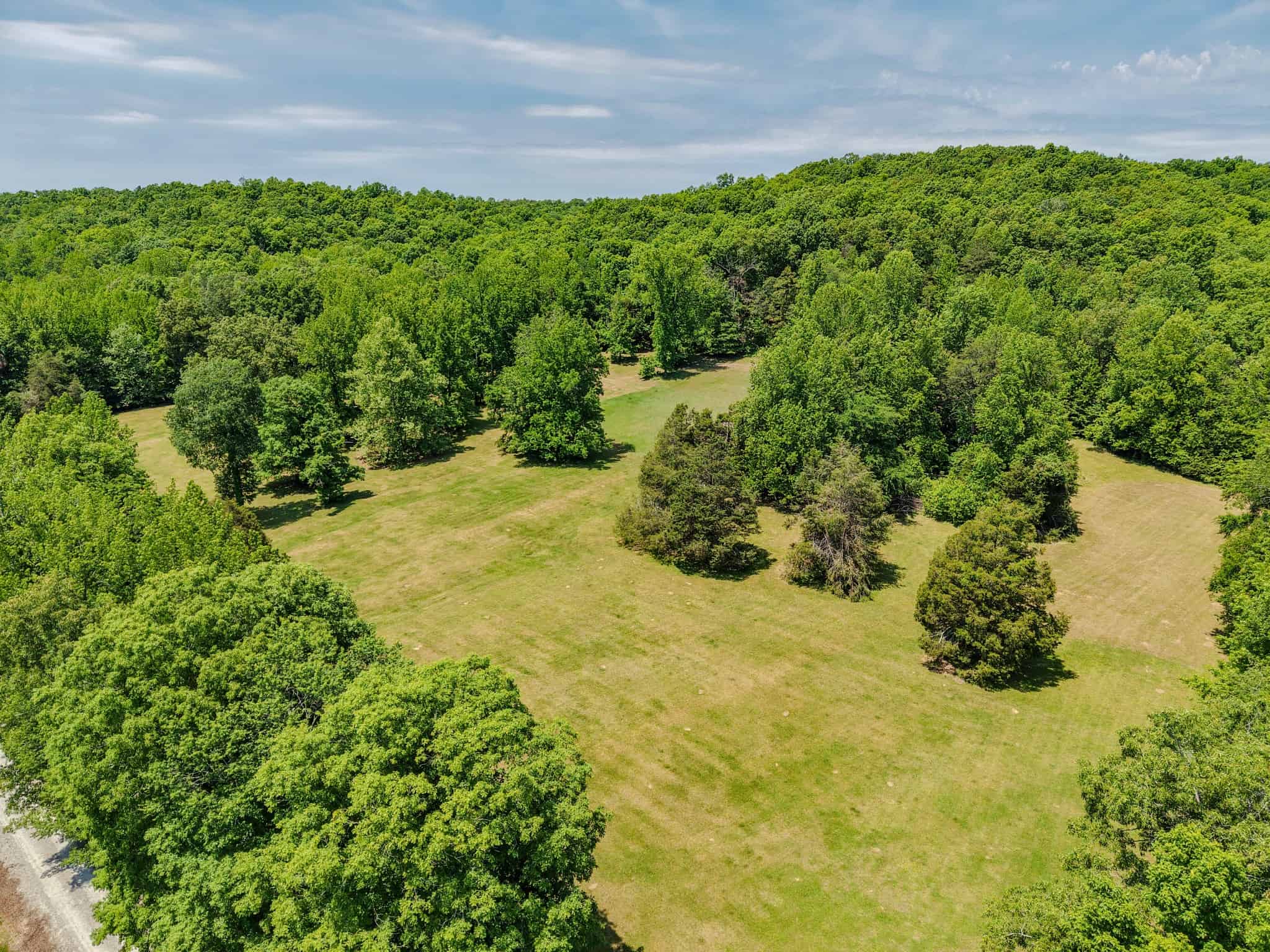 PRIVATE 394 ACRE TENNESSEE ESTATE WITH HOME, SHOP, CREEK, POND,TEARMING WITH WHITETAIL DEER AND TURKEY
