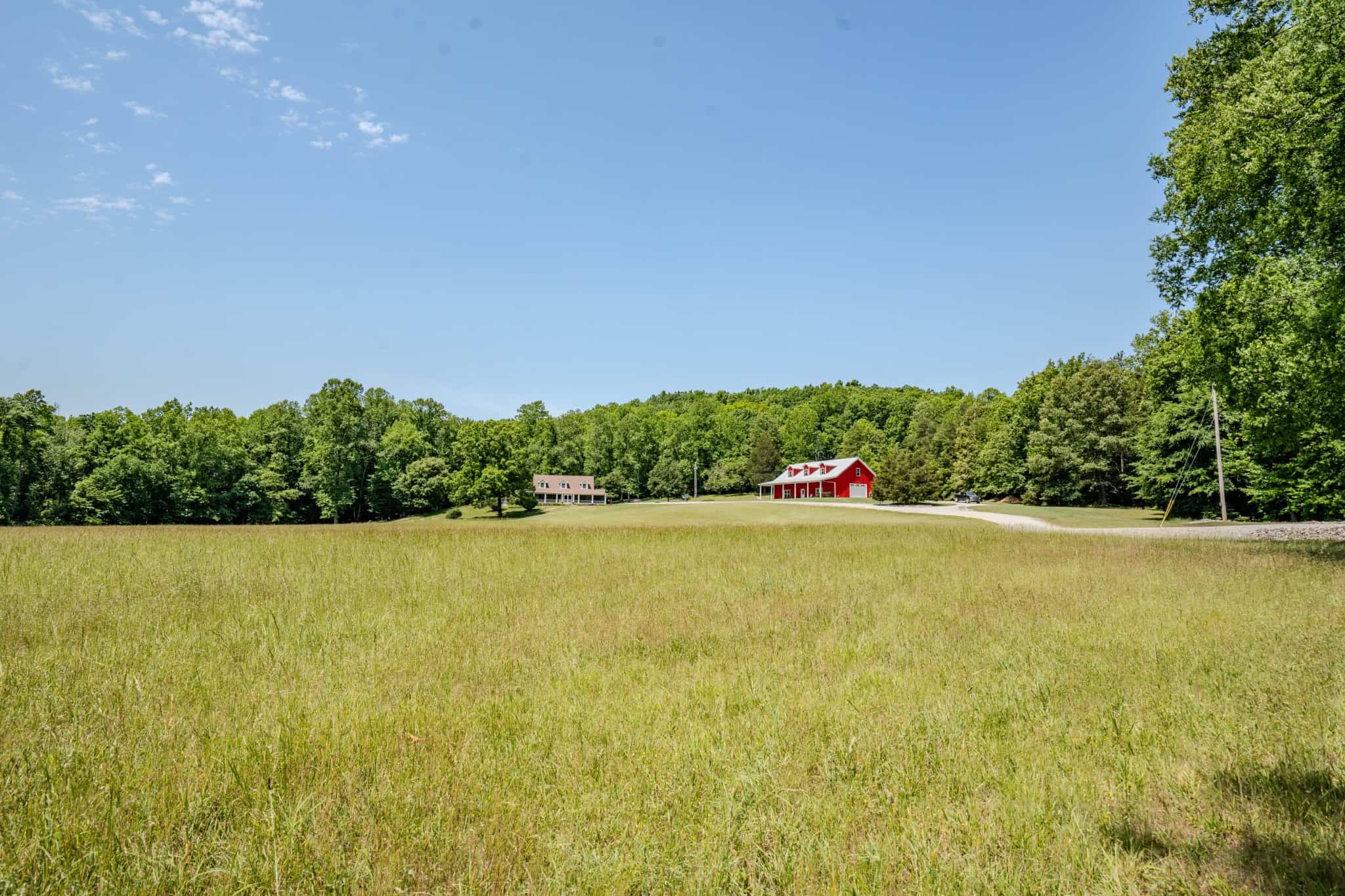 PRIVATE 394 ACRE TENNESSEE ESTATE WITH HOME, SHOP, CREEK, POND,TEARMING WITH WHITETAIL DEER AND TURKEY