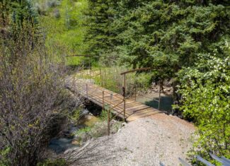 Colorado Mountain Hunting Retreat Surrounded By Thousands of Acres of Public Land in Garfield County With Low Flowing Creek and Multiple Cabins and Lodge