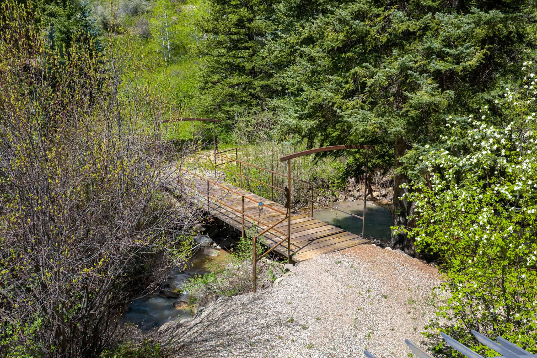 Colorado Mountain Hunting Retreat Surrounded By Thousands of Acres of Public Land in Garfield County With Low Flowing Creek and Multiple Cabins and Lodge