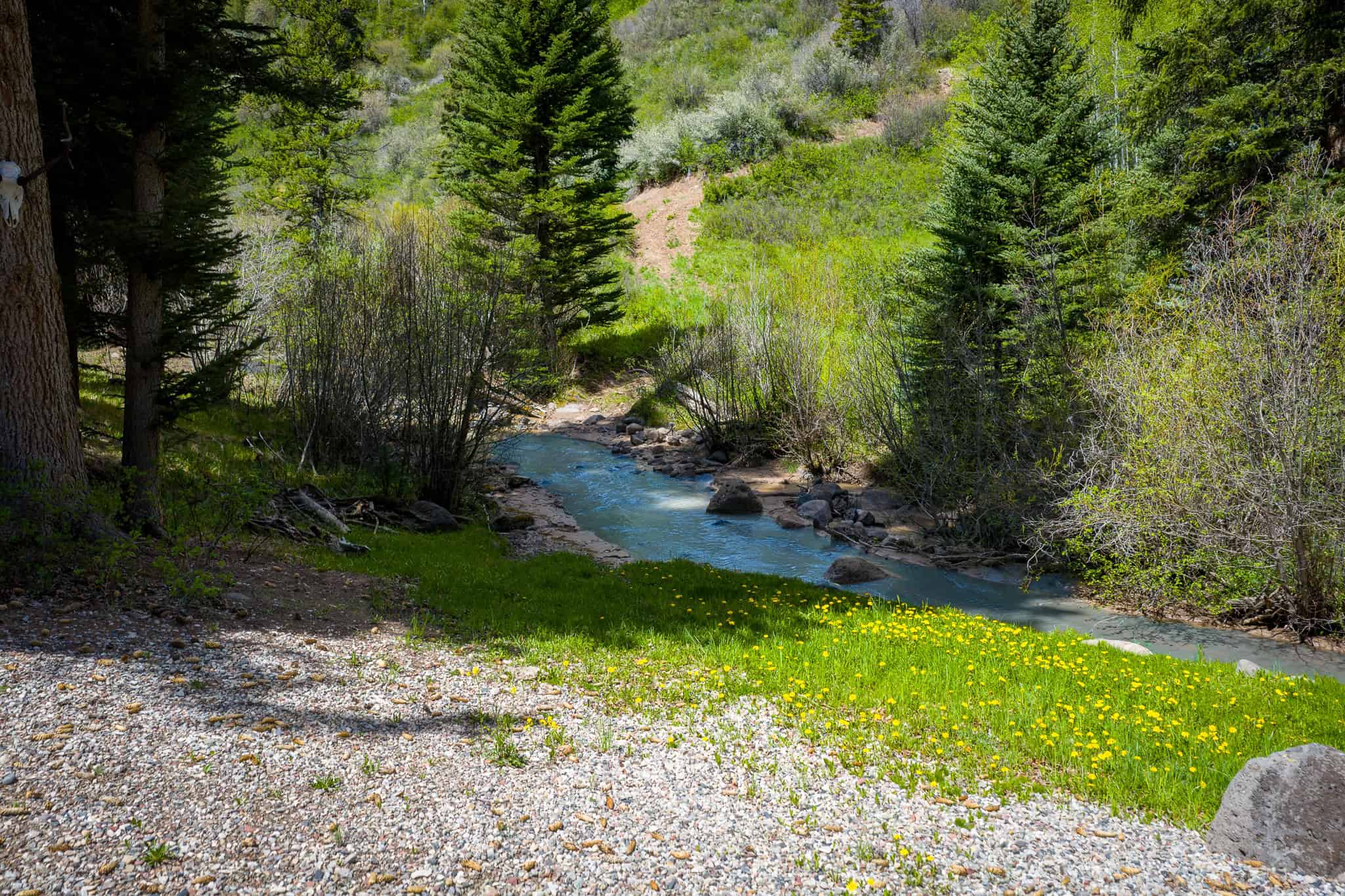 Colorado Mountain Hunting Retreat Surrounded By Thousands of Acres of Public Land in Garfield County With Low Flowing Creek and Multiple Cabins and Lodge