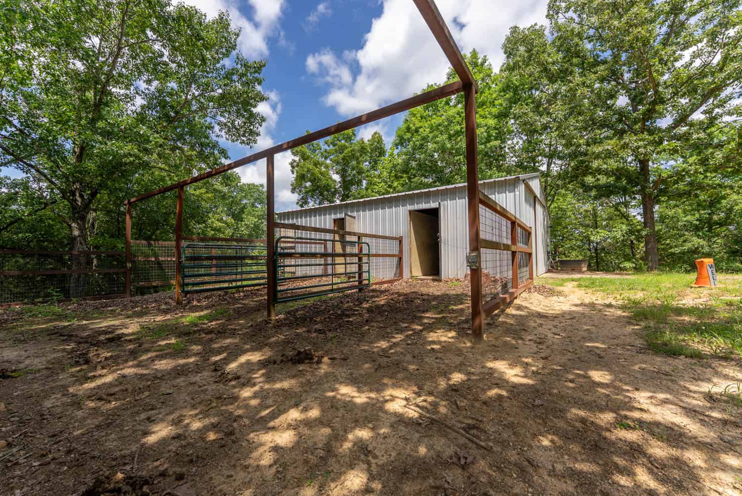 88-Acre Horse Farm with Custom Ranch Home, Stables, Ponds & Private Gated Drive
