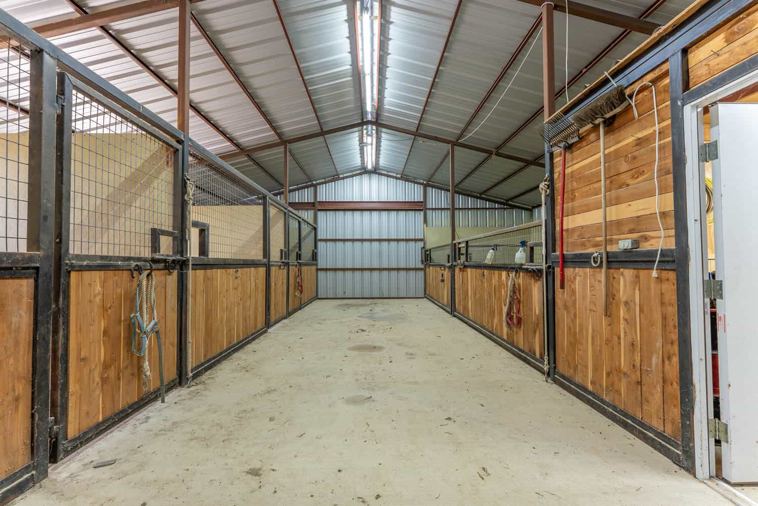 88-Acre Horse Farm with Custom Ranch Home, Stables, Ponds & Private Gated Drive