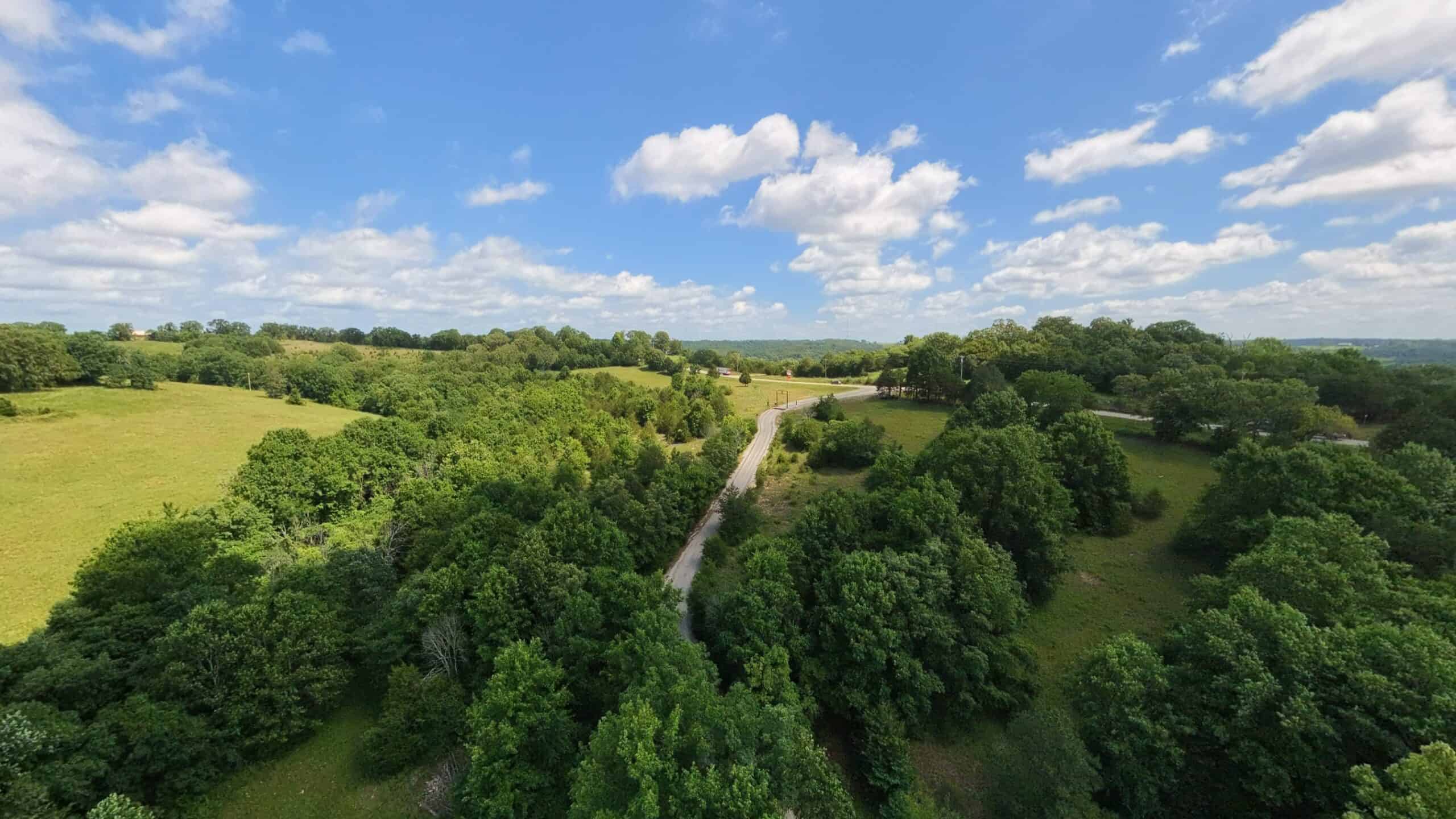 88-Acre Horse Farm with Custom Ranch Home, Stables, Ponds & Private Gated Drive