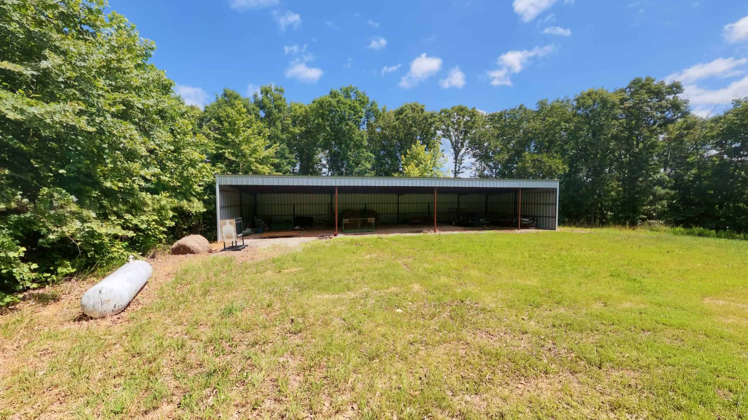 88-Acre Horse Farm with Custom Ranch Home, Stables, Ponds & Private Gated Drive