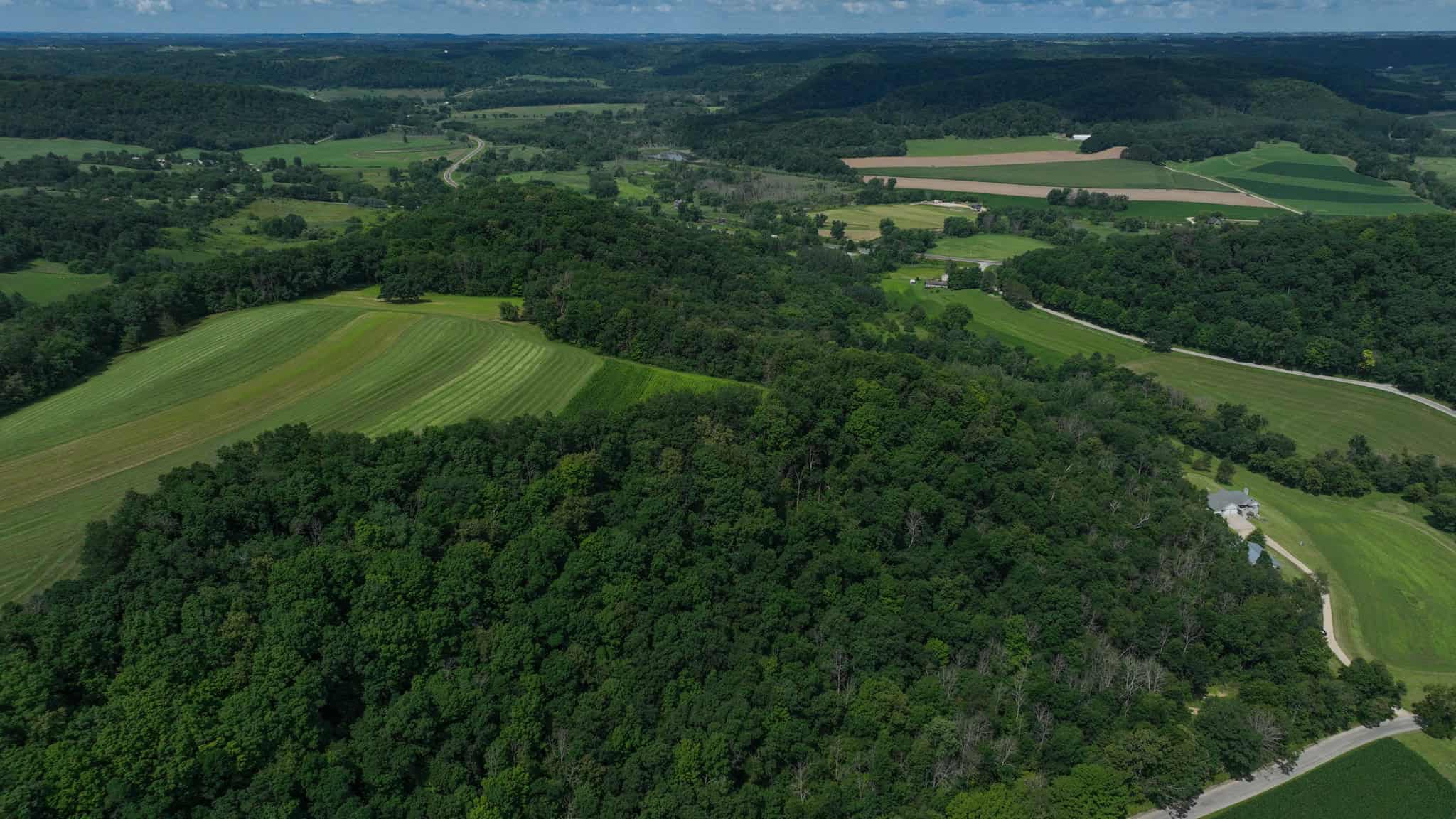 Luxury Vernon County Estate on 141 Acres with Organic Farmland, Views & Hunting