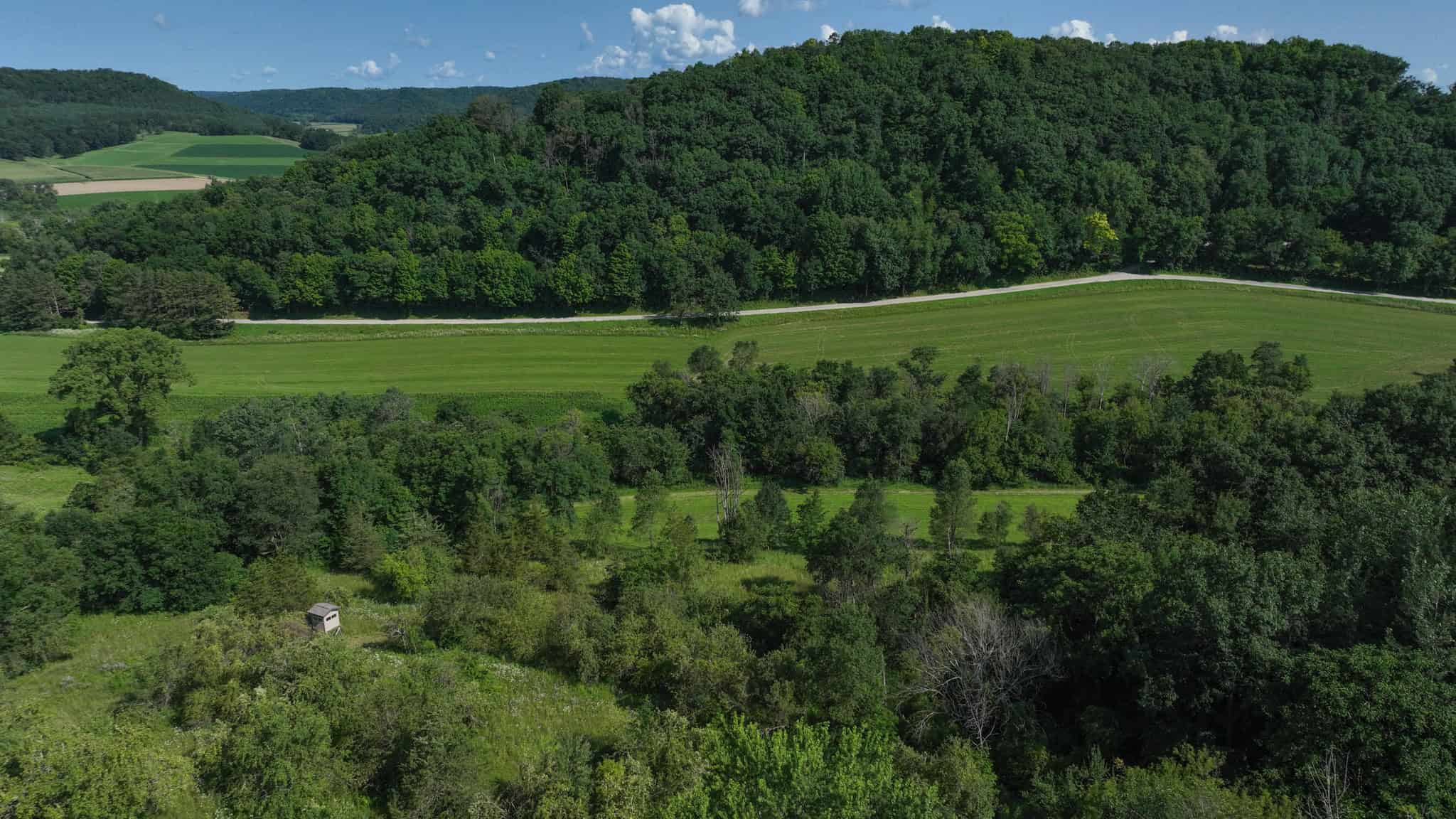 Luxury Vernon County Estate on 141 Acres with Organic Farmland, Views & Hunting