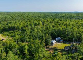 Escape to Maine: Off-Grid Solar Cabin on 45 Acres with Brook