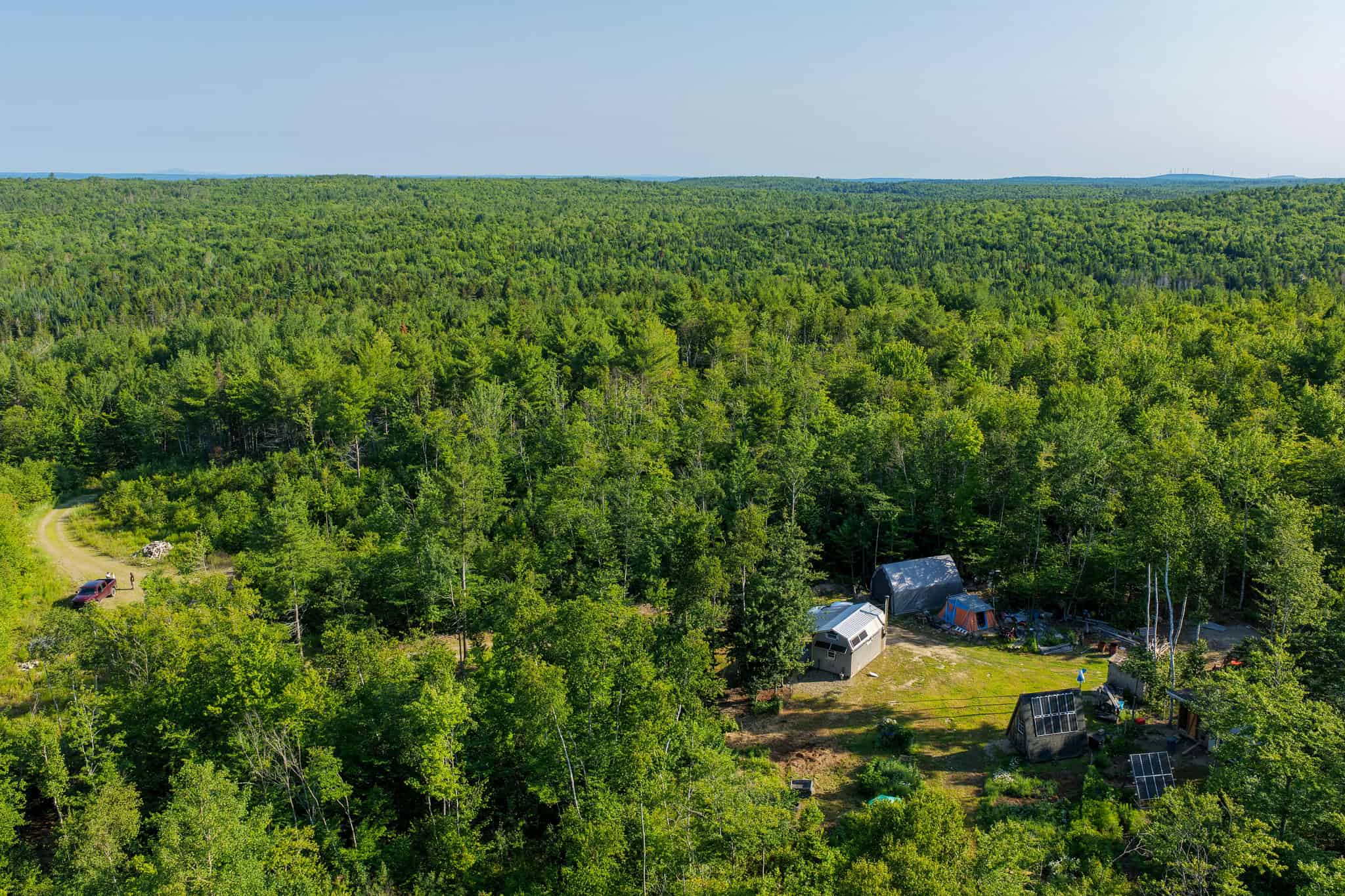 Escape to Maine: Off-Grid Solar Cabin on 45 Acres with Brook