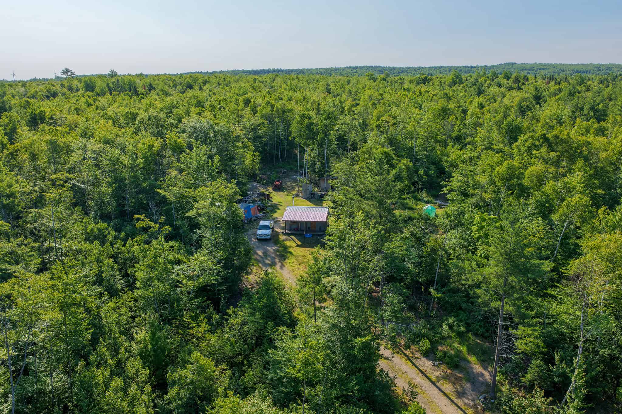 Escape to Maine: Off-Grid Solar Cabin on 45 Acres with Brook