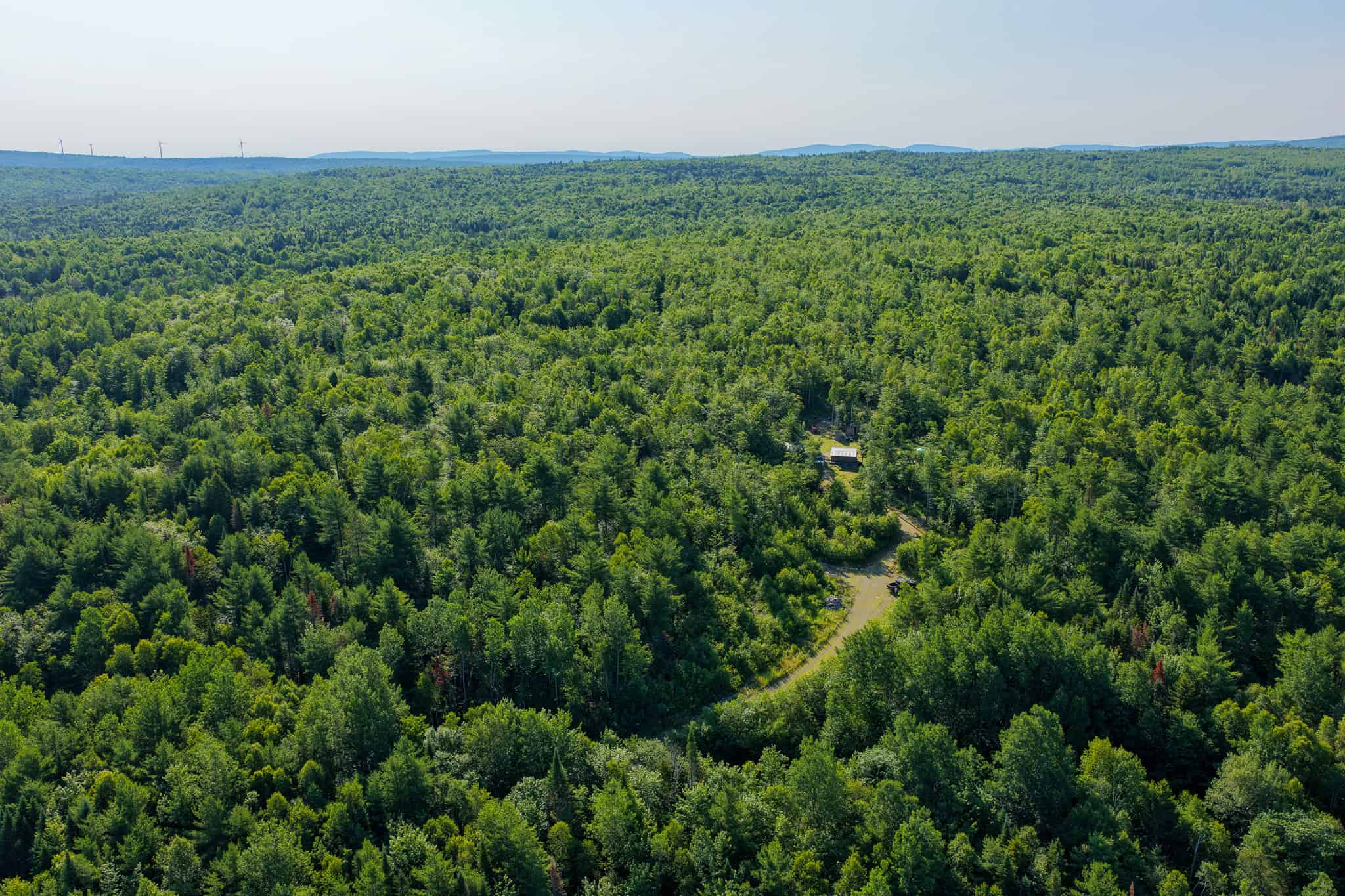 Escape to Maine: Off-Grid Solar Cabin on 45 Acres with Brook