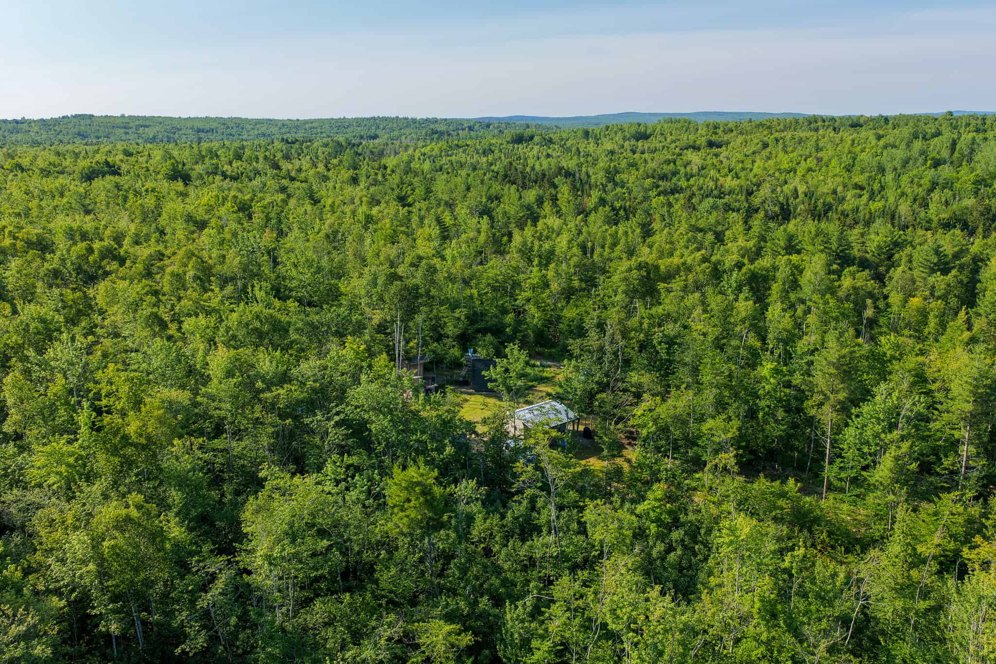Escape to Maine: Off-Grid Solar Cabin on 45 Acres with Brook