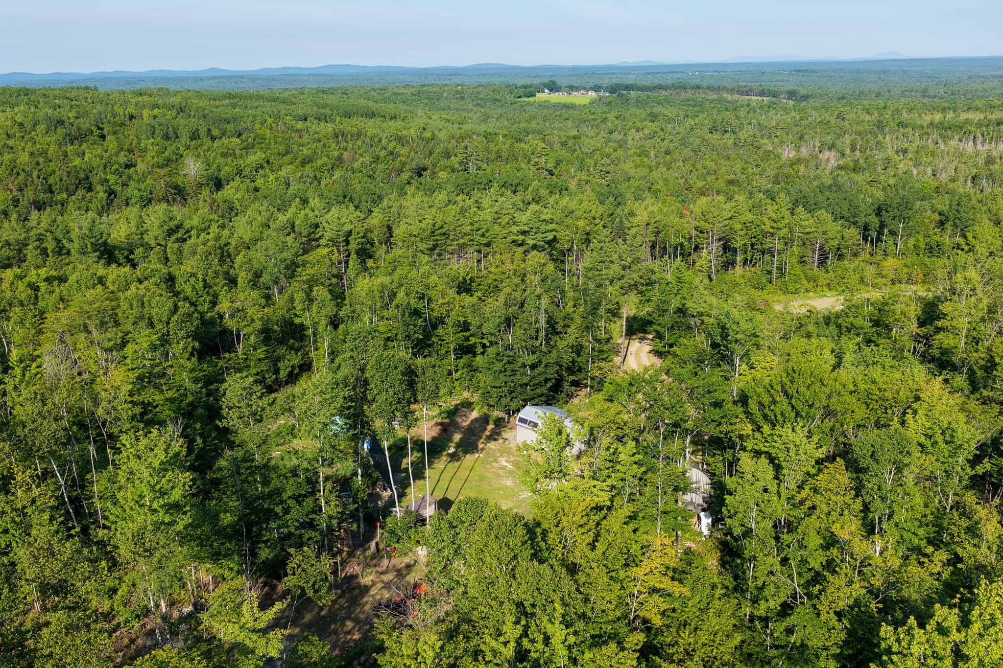 Escape to Maine: Off-Grid Solar Cabin on 45 Acres with Brook