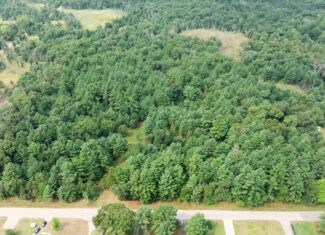 Rare opportunity to own 17.54 wooded acres within the City of Adams