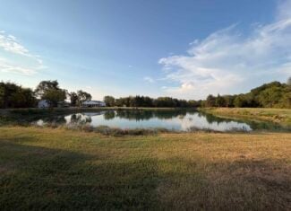 82.61-Acre Hunter’s Retreat with Stocked Lake & Barndominium