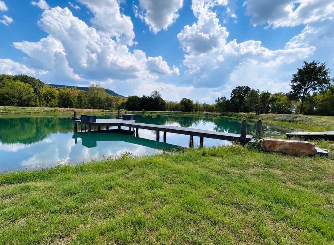 82.61-Acre Hunter’s Retreat with Stocked Lake & Barndominium