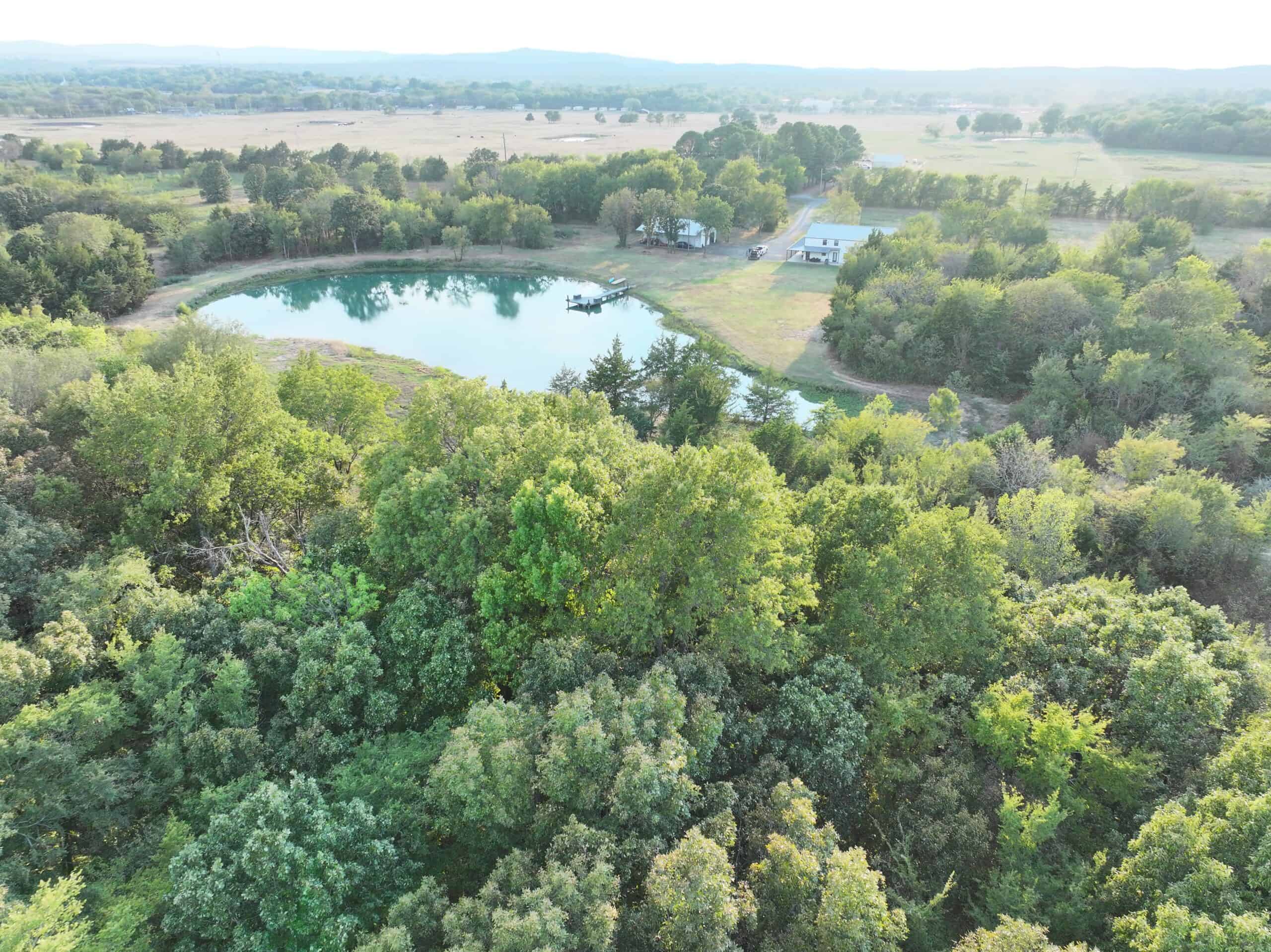 82.61-Acre Hunter’s Retreat with Stocked Lake & Barndominium