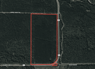 80± acres of heavily timbered recreational land featuring rolling terrain