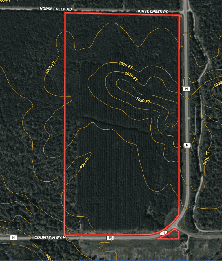 80± acres of heavily timbered recreational land featuring rolling terrain